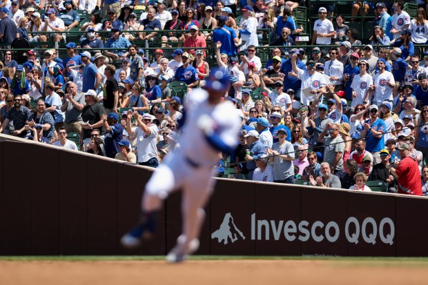 Chicago Cubs fans cheer after outfielder Mike Tauchman hits a triple during the third inning against the Pittsburgh Pirates at Wrigley Field on May 19, 2024. (Eileen T. Meslar/Chicago Tribune)