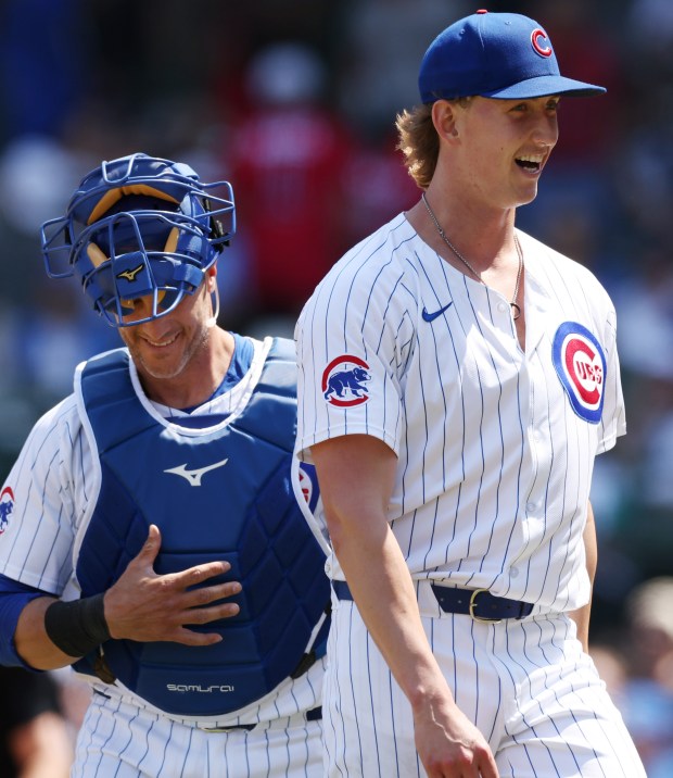 Cubs catcher Yan Gomes, left, and pitcher Ben Brown smile while heading to the dugout after the top of the fourth inning on May 23, 2024, at Wrigley Field. (John J. Kim/Chicago Tribune)