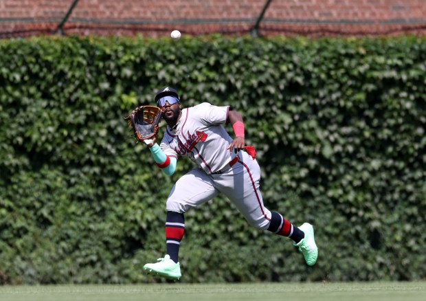 Braves center fielder Michael Harris II catches a fly ball by Cubs right fielder Seiya Suzuki in the fifth inning on May 23, 2024, at Wrigley Field. (John J. Kim/Chicago Tribune)