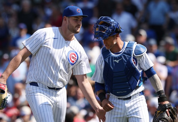 Cubs pitcher Luke Little, left, and catcher Yan Gomes head to the dugout after the top of the seventh inning on May 23, 2024, at Wrigley Field. (John J. Kim/Chicago Tribune)