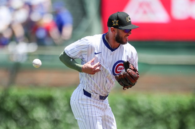 Chicago Cubs second base Miles Mastrobuoni bobbles the ball during the first inning against the Pittsburgh Pirates at Wrigley Field on May 19, 2024. (Eileen T. Meslar/Chicago Tribune)