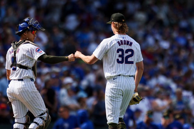 Chicago Cubs catcher Miguel Amaya (9) gives pitcher Ben Brown (32) a fist bump during the eighth inning against the Pittsburgh Pirates at Wrigley Field on May 19, 2024. (Eileen T. Meslar/Chicago Tribune)