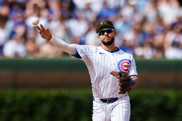 Chicago Cubs third base Nick Madrigal (1) throws to first base during the ninth inning against the Pittsburgh Pirates at Wrigley Field on May 19, 2024. (Eileen T. Meslar/Chicago Tribune)