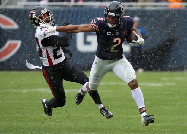 Chicago Bears wide receiver DJ Moore (2) catches a pass and runs for a first down in the third quarter during a game between the Chicago Bears and Atlanta Falcons at Soldier Field on Sunday, Dec. 31, 2023, in Chicago. The Bears won 37-17. (Stacey Wescott/Chicago Tribune)
