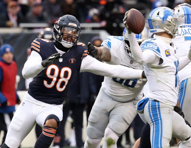 Chicago Bears defensive end Montez Sweat (98) chases Detroit Lions quarterback Jared Goff in the fourth quarter at Soldier Field on Dec. 10, 2023, in Chicago. (John J. Kim/Chicago Tribune)