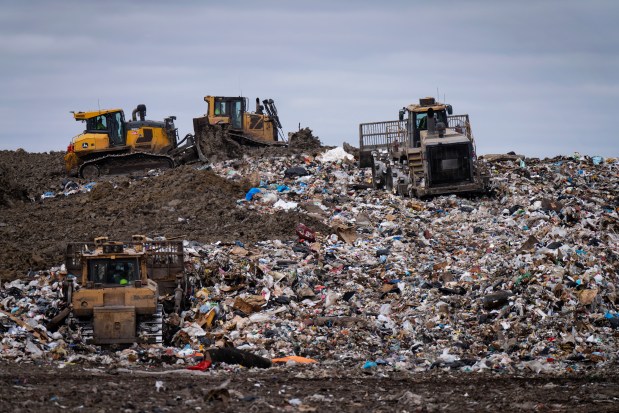 Waste is compacted during operations on the working face of the Winnebago County Landfill in Rockford, March 18, 2024. (E. Jason Wambsgans/Chicago Tribune)