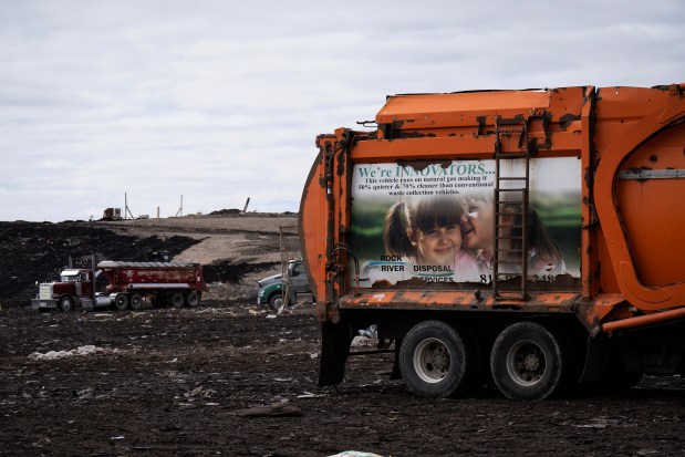 Waste is transported during operations on the working face of the Winnebago County Landfill in Rockford, March 18, 2024. (E. Jason Wambsgans/Chicago Tribune)