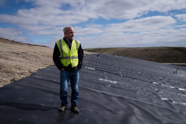 Thomas Hilbert, region engineer for Waste Connections, walks on the Winnebago County Landfill on March 18, 2024. (E. Jason Wambsgans/Chicago Tribune)