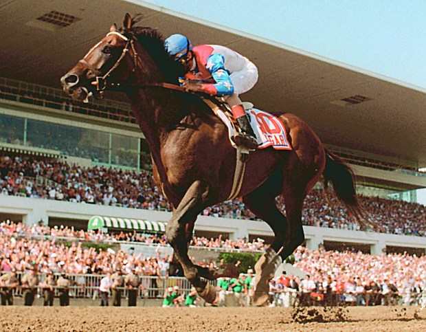 Jerry Bailey rides Cigar across the finish line July 13, 1996, in Arlington Heights to win the Arlington Citation Challenge. (AP Photo/Jane Gibson)