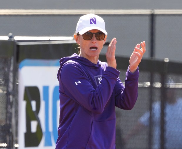 Northwestern softball coach Kate Drohan encourages hitters during a game against Indiana on May 5, 2024, in Evanston. The Wildcats beat the Hoosiers 4-2, clinching the Big Ten championship for the thrid year in a row. (Stacey Wescott/Chicago Tribune)