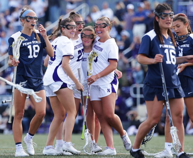 Northwestern players, from left, Lindsey Frank, Izzy Scane, Erin Coykendall and Dylan Amonte celebrate a goal by Coykendall during the Big Ten Tournament final against Penn State on May 4, 2024, in Evanston. Northwestern beat Penn State 14-12. (Stacey Wescott/Chicago Tribune)