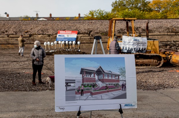 An artist's rendering stands at the then-future Peterson/Ridge Metra station on Nov. 1, 2021, as officials hold a groundbreaking ceremony. The station, on the Union Pacific North Line, is expected to open May 20, 2024. (Brian Cassella/Chicago Tribune)