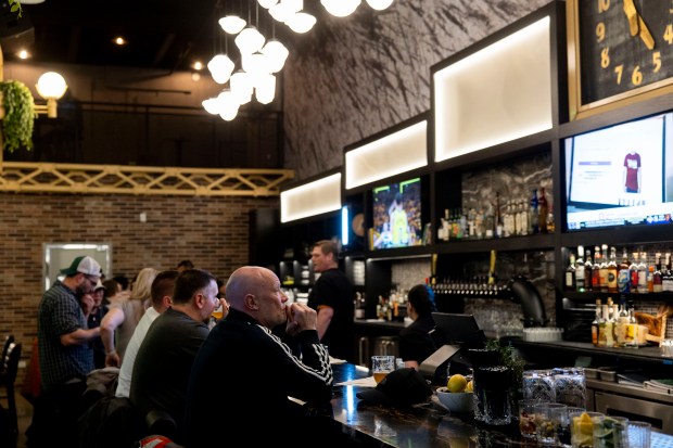 Stewart Moore, of Manchester, England, sits at the bar on April 26, 2024, at Industry Ales in Chicago. (Vincent Alban/Chicago Tribune)