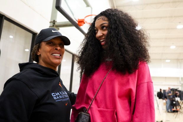 Sky forward Angel Reese, right, speaks to coach Teresa Weatherspoon after a news conference at Sachs Recreation Center in Deerfield on April 24, 2024. (Eileen T. Meslar/Chicago Tribune)