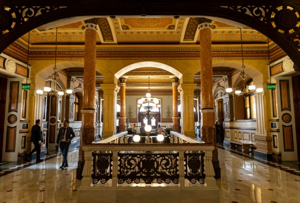 People walk through the Illinois State Capitol in Springfield on April 11, 2024. (Brian Cassella/Chicago Tribune)