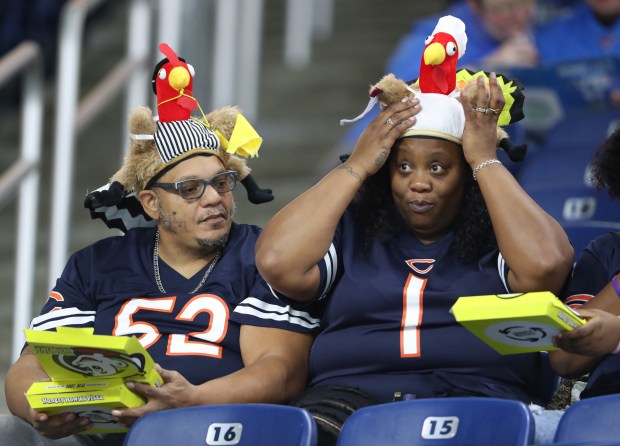 A Chicago Bears fan adjusts her Thanksgiving turkey hat before a game between the Bears and Detroit Lions at Ford Field Thursday, Nov. 25, 2021, in Detroit. (John J. Kim/Chicago Tribune)