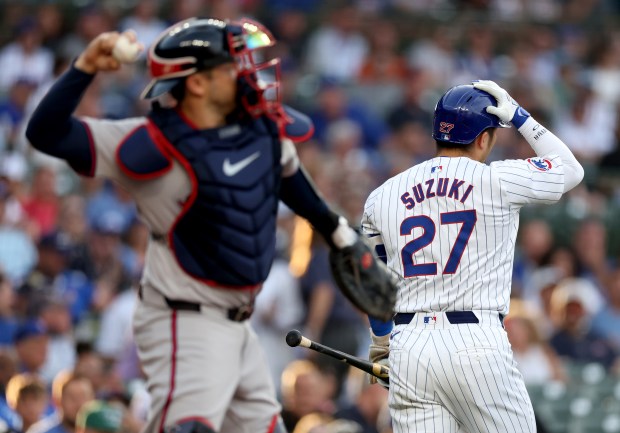 Chicago Cubs outfielder Seiya Suzuki (27) heads to the dugout after striking out in the first inning of a game against the Atlanta Braves at Wrigley Field in Chicago on May 21, 2024. (Chris Sweda/Chicago Tribune)