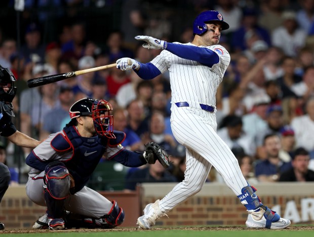 Chicago Cubs designated hitter Mike Tauchman drives in a run on a single in the sixth inning of a game against the Atlanta Braves at Wrigley Field in Chicago on May 21, 2024. (Chris Sweda/Chicago Tribune)