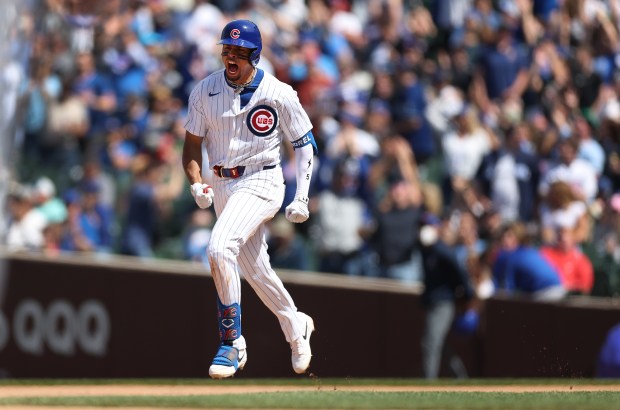 Cubs third baseman Christopher Morel celebrates as he rounds the bases after hitting a solo home run in the sixth inning against the Brewers on Friday, May 3, 2024, at Wrigley Field. (Chris Sweda/Chicago Tribune)