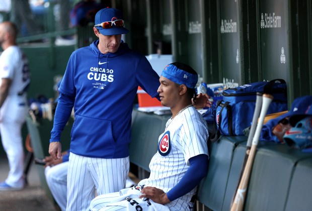 Cubs reliever Adbert Alzolay is comforted by manager Craig Counsell in the dugout after Counsell pulled Alzolay in the eighth inning against the Brewers on Friday, May 3, 2024, at Wrigley Field. (Chris Sweda/Chicago Tribune)