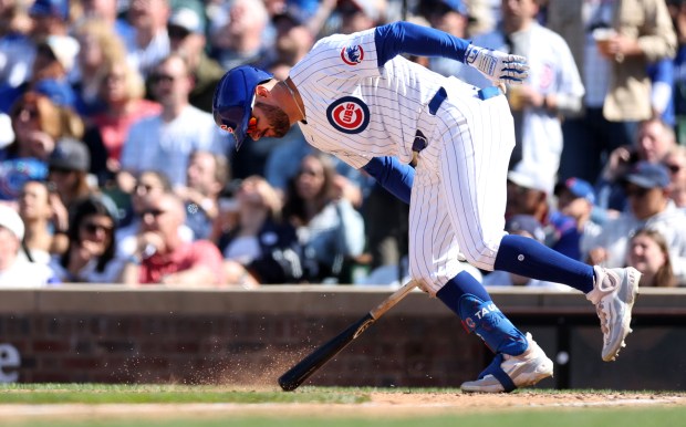 Cubs right fielder Mike Tauchman pounds his bat into the ground as he flies out in the eighth inning against the Brewers on Friday, May 3, 2024, at Wrigley Field. (Chris Sweda/Chicago Tribune)