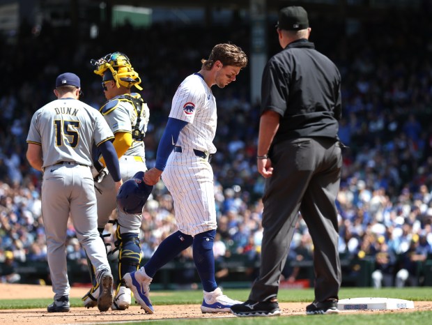 Cubs second baseman Nico Hoerner walks back to the dugout after being tagged out at third base in the fifth inning against the Brewers on Friday, May 3, 2024, at Wrigley Field. (Chris Sweda/Chicago Tribune)