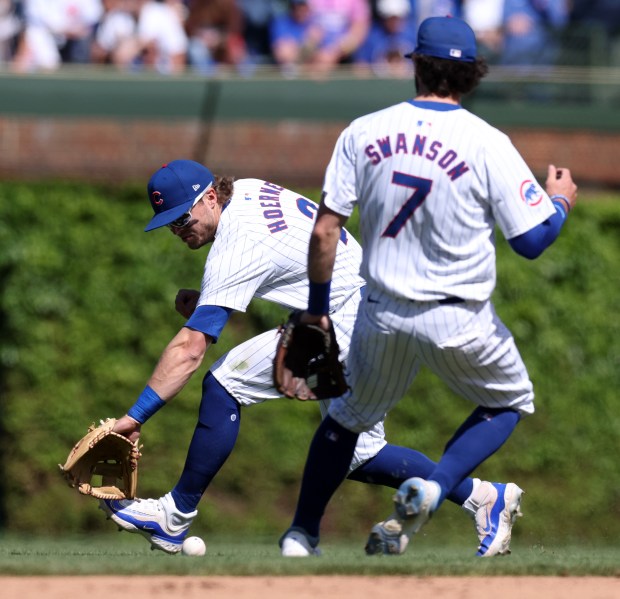 Cubs second baseman Nico Hoerner backhands a ball that went for a single by the Brewers' Jackson Chourio in the eighth inning on Friday, May 3, 2024, at Wrigley Field. (Chris Sweda/Chicago Tribune)