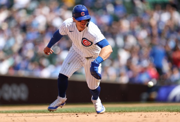 Cubs second baseman Nico Hoerner reverses his direction before being tagged out between second and third base in the fifth inning against the Brewers on Friday, May 3, 2024, at Wrigley Field. (Chris Sweda/Chicago Tribune)
