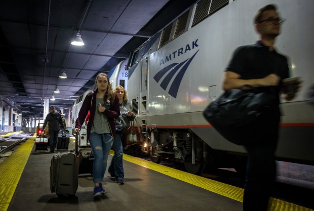 Passengers board an Amtrak Empire Builder train in 2017 at Union Station. The new Borealis service will replace one of the Hiawatha trains and supplement the Empire Builder, and make all existing stops on each route, Amtrak said. (Brian Cassella/Chicago Tribune)