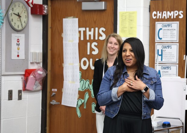 Fifth grade teacher Rachael Mahmood reacts after learning she won Illinois Teacher of the Year at Georgetown Elementary School on May 2, 2024, in Aurora. Standing behind her is principal Jill Keller. (Stacey Wescott/Chicago Tribune)