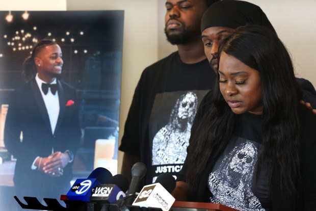 Brothers Bryan Biename and Jay Charles and Jeanna Joseph Kelly, sister of Abnerd Joseph, become emotional while speaking about her brother following an announcement of the filing of a civil lawsuit for wrongful death in the September 2023 killing of high school assistant principal Abnerd Joseph, during a news conference at the law offices of Romanucci and Blandin in Chicago on May 15, 2024. (Antonio Perez/Chicago Tribune)