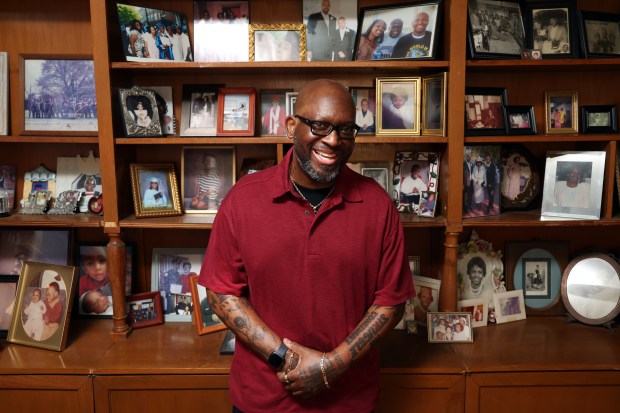 Art Gillespie at home in Chicago with generations of family photos on May 23, 2024. He received a double lung transplant after one lung was damaged by lung cancer and the other by COVID-19. The cancer diagnosis came in 2020. (Terrence Antonio James/Chicago Tribune)