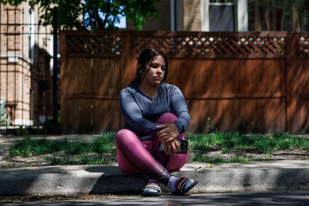 Karis Calderon, 25, from Venezuela poses for a portrait near her home on April 30, 2024, in Chicago. Her daughter, Luciana Valentina Suarez Calderon, 3, who made the journey with her mother, died from a bacterial infection on April 25 after the family walked through seven countries from Venezuela. (Armando L. Sanchez/Chicago Tribune)