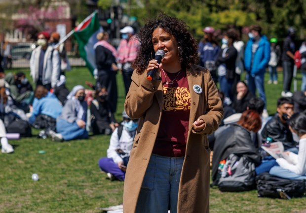 Ald. Rossana Rodriguez-Sanchez, 33rd, speaks with students and activists at a pro-Palestinian encampment after police attempted to remove the tents earlier in the day at Northwestern University, April 25, 2024, in Evanston. (Armando L. Sanchez/Chicago Tribune)