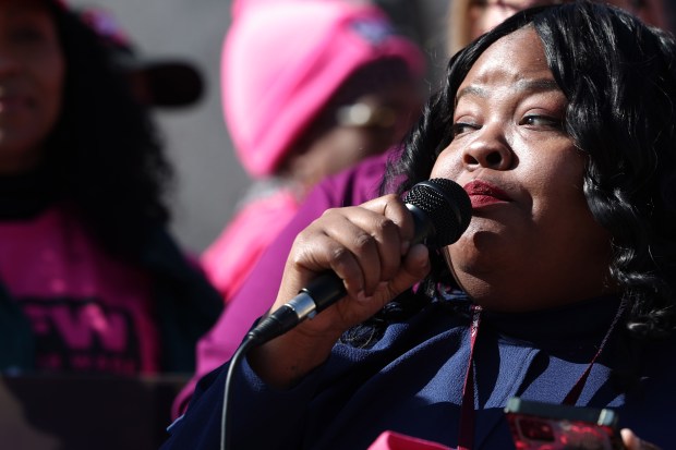 State Sen. Lakesia Collins, D-Chicago, talks about the importance of boosting base pay for all tipped workers outside of the state Capitol in Springfield on Feb. 6, 2024. Legislation to eliminate the subminimum wage for tipped workers in the state is unlikely to pass this session. (Stacey Wescott/Chicago Tribune)