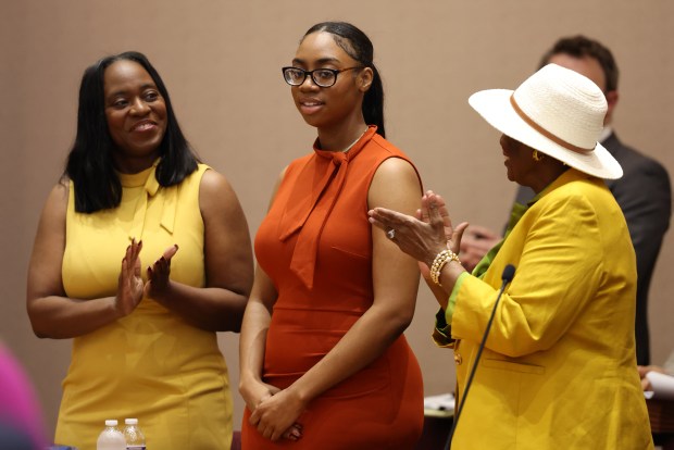 Dorothy Jean Tillman, 18, is honored during a City Council meeting on May 22, 2024. She recently graduated with a PhD in integrated behavioral health from Arizona State University. (Antonio Perez/Chicago Tribune)