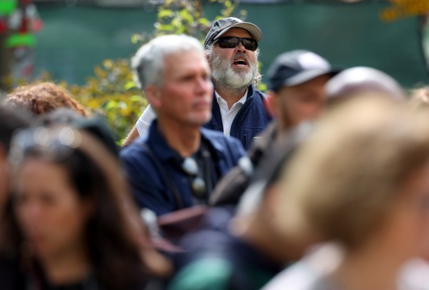 A counterprotester shouts questions at University of Chicago faculty and staff during a press conference on campus on May 6, 2024, in Chicago. University of Chicago Faculty for Justice for Palestine (FJP), a collective of over 130 faculty and academic staff, announced its support of the on-campus student encampment today. (Stacey Wescott/Chicago Tribune)