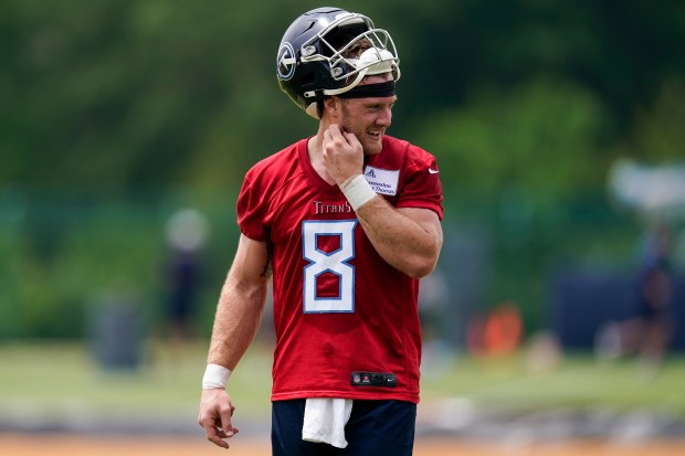Titans quarterback Will Levis walks across the field during OTAs on May 23, 2023, in Nashville, Tenn. (AP Photo/George Walker IV)
