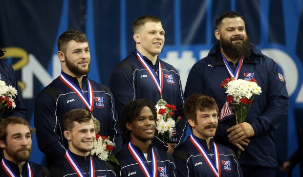 Chicago native Joe Rau, top and center, celebrates on April 10, 2016 as he's honored with other winners of the U.S. Olympic wrestling trials at Carver-Hawkeye Arena in Iowa City. (Brian Cassella/Chicago Tribune)