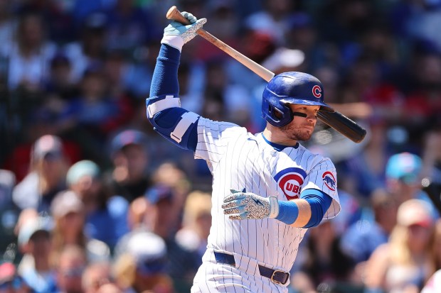 Cubs left fielder Ian Happ strikes out swinging against the Padres during the fourth inning on May 8, 2024, at Wrigley Field. (Michael Reaves/Getty)