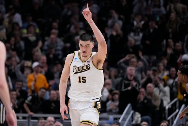 Purdue's Zach Edey (15) celebrates after scoring during the first half of a second-round college basketball game against Utah State in the NCAA Tournament, Sunday, March 24, 2024 in Indianapolis. (AP Photo/Michael Conroy)