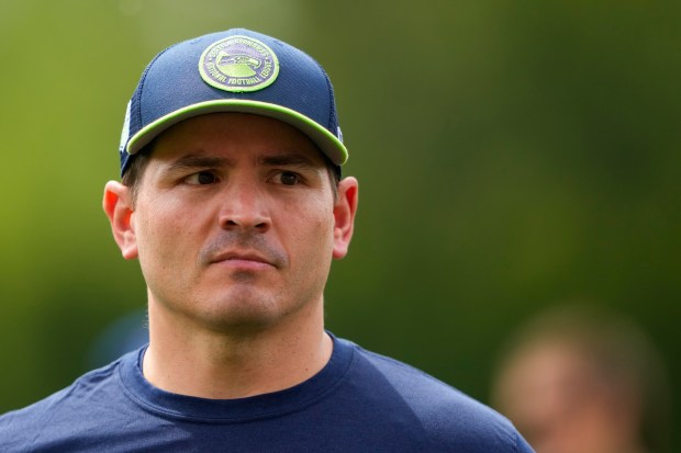 Seahawks coach Mike Macdonald walks off the field following the rookie minicamp on May 3, 2024, in Renton, Wash. (Lindsey Wasson/AP)