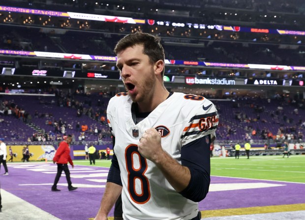 Kicker Cairo Santos reacts to the cheers of the crowd as he heads off the field after the Bears beat the Vikings 12-10 at U.S. Bank Stadium in Minneapolis. (Stacey Wescott/Chicago Tribune)