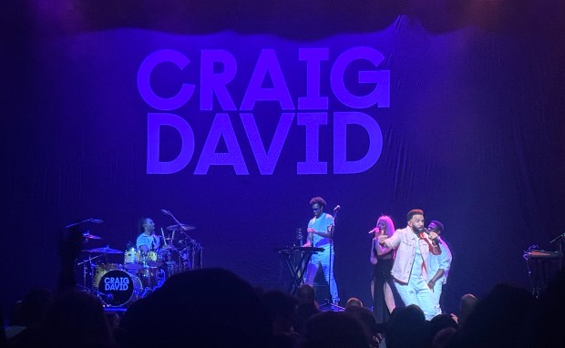 Craig David and band perform for his 7 Days Commitment Tour at the Chicago Theatre on May 13, 2024. (Britt Julious / for the Chicago Tribune)