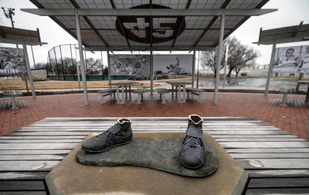 FILE - A bronze statue of legendary baseball pioneer Jackie Robinson was stolen from a park in Wichita, Kan., during the early morning hours of Thursday, Jan. 25, 2024. Police announced Tuesday, Feb. 13, the arrest of a man in the theft of the Jackie Robinson statue that later was found dismantled and burned. (Travis Heying/The Wichita Eagle via AP, File)