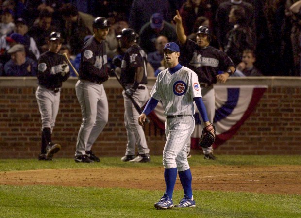 The Marlins celebrate behind Cubs starting pitcher Mark Prior during a rally in the top of the eighth inning of Game 6 of the National League Championship Series on Oct. 14, 2003, at Wrigley Field. Twelve Marlins batters came to the play during the eight-run inning, leading to an 8-3 Cubs loss. (Scott Strazzante/Chicago Tribune)