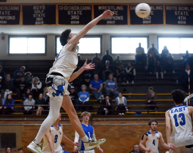 Lincoln-Way East's Matthew Muehlnickel (10) follows through on the swing against Lockport during a SouthWest Suburban Conference match in Lockport on Tuesday, April 25, 2023.