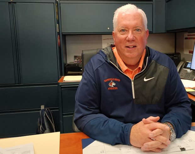 Naperville North athletic director Bob Quinn, pictured at his desk on Friday, May 10, 2024, is retiring after 38 years in education. (Matt Le Cren / Naperville Sun)