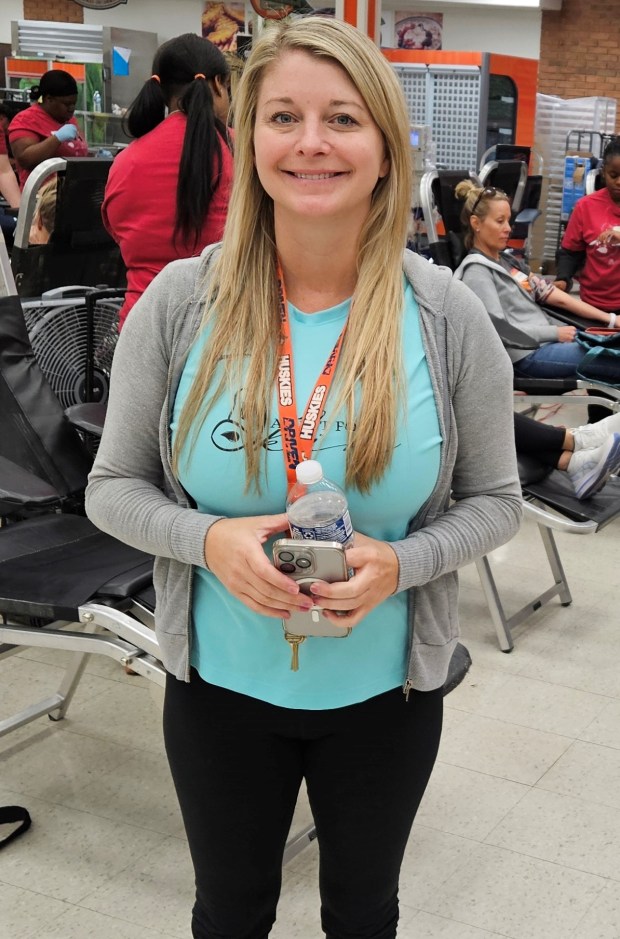 Kristyn Benedyk, of Lisle, co-founded the annual A Pint for Kim blood drive, held Saturday at Naperville North High School, after the death of her sister, Naperville resident Kimberley Benedyk Sandford. (David Sharos/Naperville Sun)