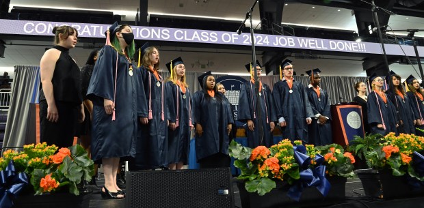 Choral members perform at the beginning of Evanston Township High School's commencement at Northwestern University's Welsh-Ryan Arena at McGaw Memorial Hall in Evanston on May 19, 2024. (Karie Angell Luc/Pioneer Press)